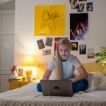 A Female Teenager Using Her Laptop